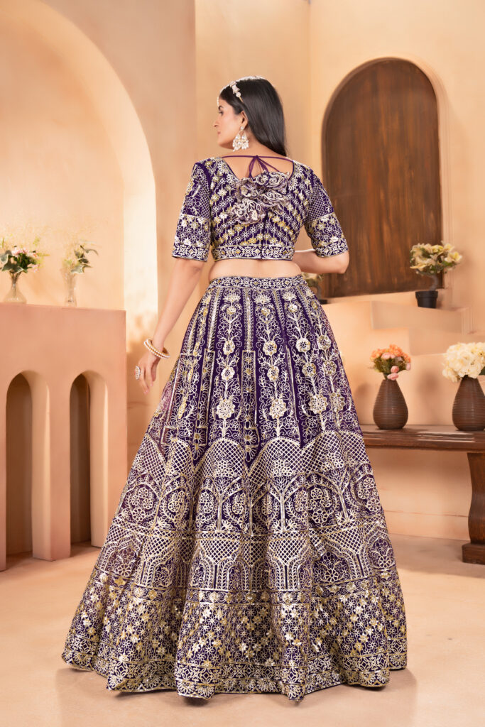 wine net lehenga choli with golden zari embroidery